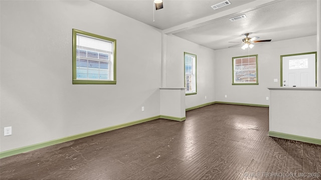 613 NW A St, Ardmore, OK 73401 - spare room featuring ceiling fan, plenty of natural light, and baseboards
