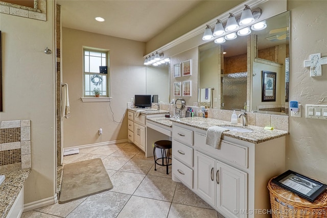 124 Walnut Rdg, Eufaula, OK 74432 - bathroom with vanity, a shower stall, a bath, tile patterned floors, and baseboards