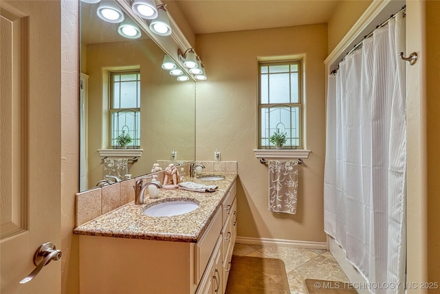 124 Walnut Rdg, Eufaula, OK 74432 - bathroom with double vanity, tile patterned floors, and baseboards