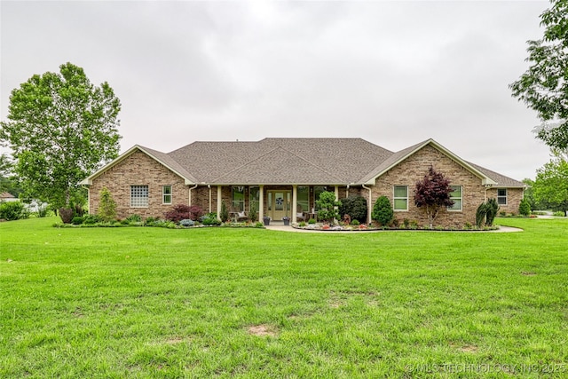 124 Walnut Rdg, Eufaula, OK 74432 - view of front of home featuring a front lawn, brick siding, covered porch, and roof with shingles