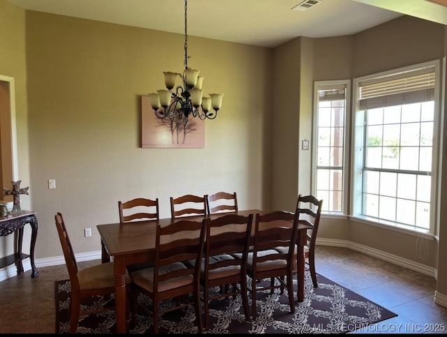 7400 E Prairie View Rd E, Kenefic, OK 74748 - tiled dining area with a chandelier and baseboards