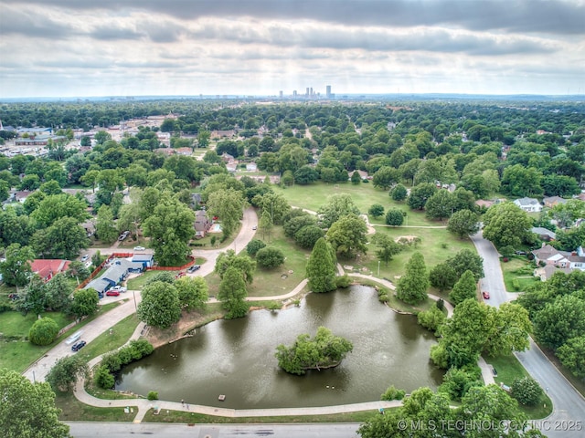 5504 E 5th Pl, Tulsa, OK 74112 - drone / aerial view of a nearby body of water and a tree filled landscape