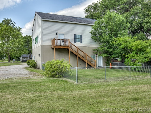 5504 E 5th Pl, Tulsa, OK 74112 - rear view of property featuring stairway