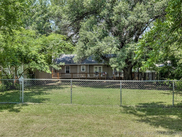 5504 E 5th Pl, Tulsa, OK 74112 - view of yard featuring french doors and a wooden deck