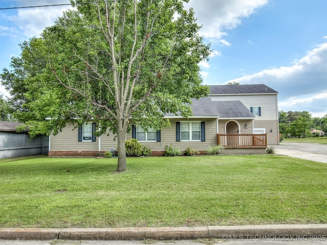 5504 E 5th Pl, Tulsa, OK 74112 - view of front facade featuring a front lawn and a shingled roof