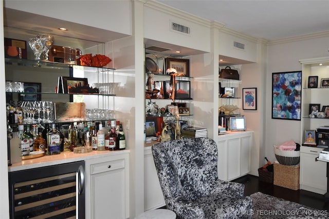 2300 Riverside Dr Unit 5E, Tulsa, OK 74114 - indoor dry bar featuring wine cooler and ornamental molding