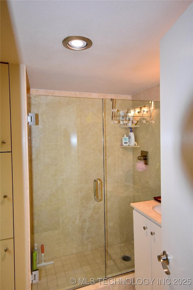 2300 Riverside Dr Unit 5E, Tulsa, OK 74114 - bathroom with a shower stall and vanity