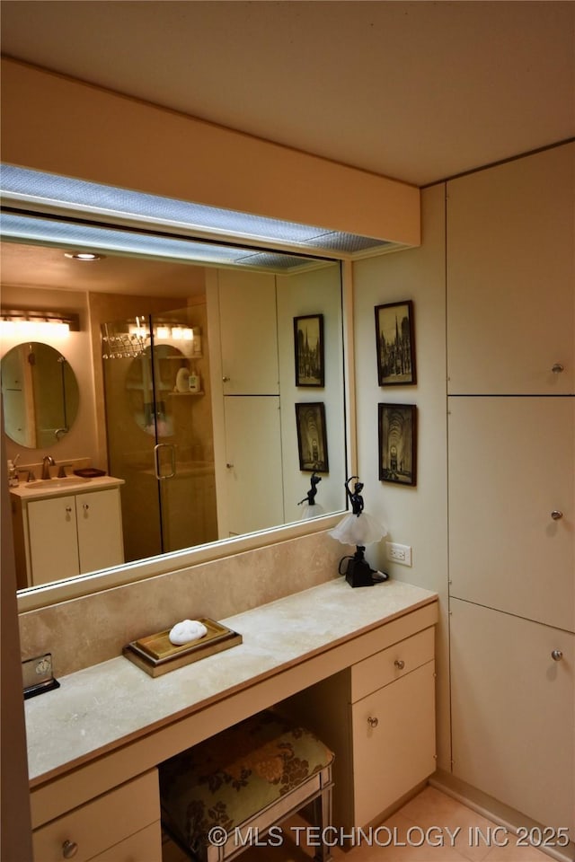 2300 Riverside Dr Unit 5E, Tulsa, OK 74114 - bathroom featuring vanity and a stall shower