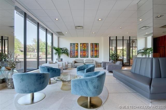 2300 Riverside Dr Unit 5E, Tulsa, OK 74114 - building lobby with a paneled ceiling and recessed lighting