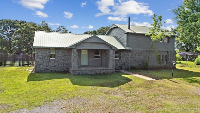 5963 S Westwood Ave, Oilton, OK 74052 - view of front facade featuring stone siding, a porch, and metal roof