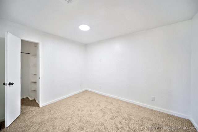 5963 S Westwood Ave, Oilton, OK 74052 - unfurnished bedroom with carpet floors, baseboards, a walk in closet, and a closet