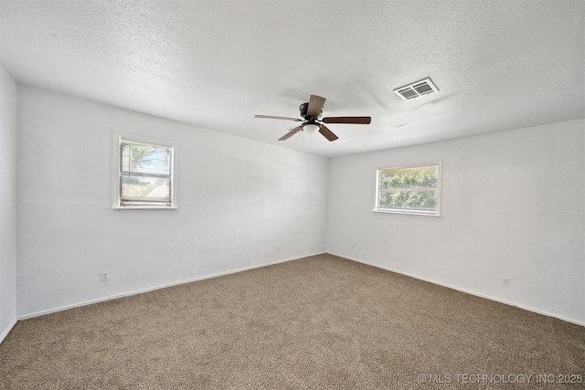 5963 S Westwood Ave, Oilton, OK 74052 - carpeted spare room featuring a ceiling fan and a textured ceiling
