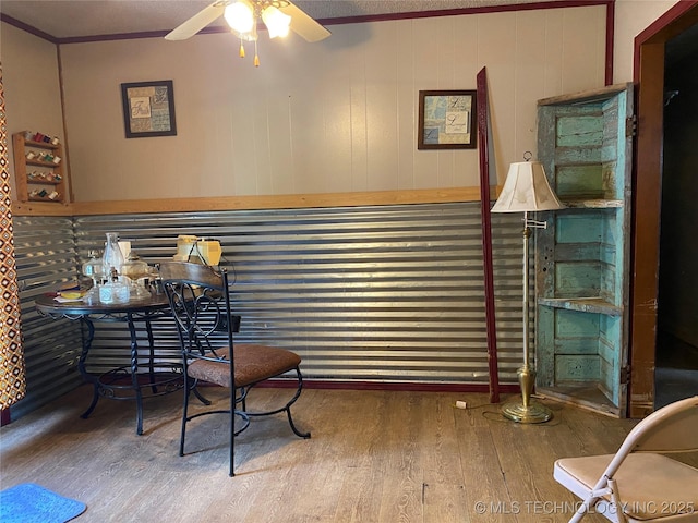 205 N Ash St, Bristow, OK 74010 - office featuring wood finished floors, ceiling fan, crown molding, and a bar