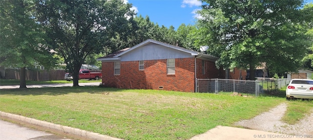 205 N Ash St, Bristow, OK 74010 - view of side of home featuring brick siding and crawl space