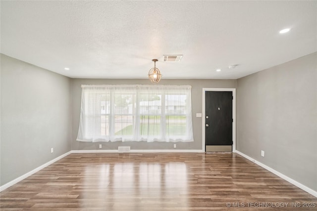 507 S Oklahoma Ave, Haskell, OK 74436 - unfurnished living room with wood finished floors, baseboards, and recessed lighting