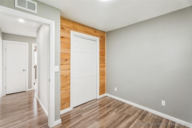 507 S Oklahoma Ave, Haskell, OK 74436 - unfurnished bedroom featuring wood finished floors, baseboards, and a closet