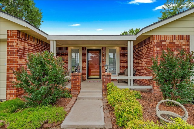 200 Turkey Creek Rd, Bartlesville, OK 74006 - property entrance featuring brick siding and a porch