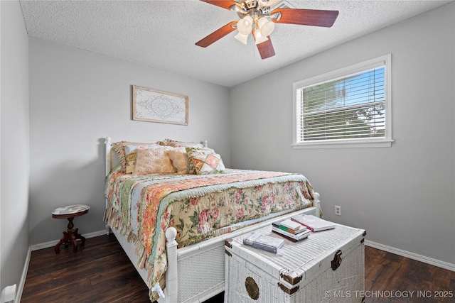 200 Turkey Creek Rd, Bartlesville, OK 74006 - bedroom with wood finished floors, baseboards, a textured ceiling, and a ceiling fan