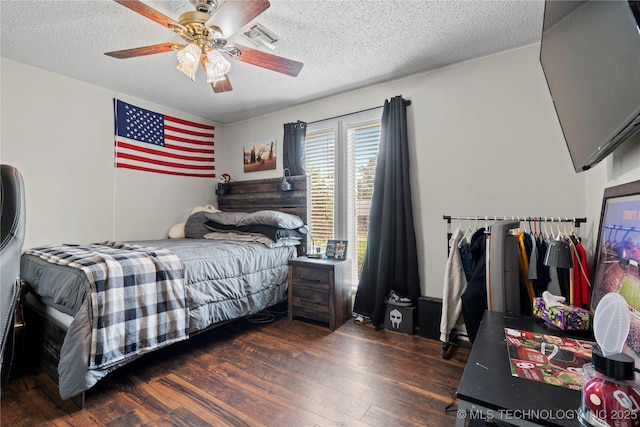200 Turkey Creek Rd, Bartlesville, OK 74006 - bedroom featuring hardwood / wood-style floors, a textured ceiling, and a ceiling fan