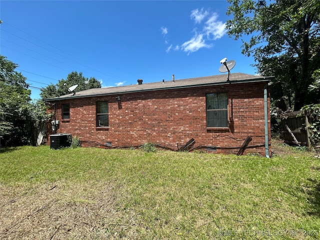 1621 Center Ln, Muskogee, OK 74403 - view of home's exterior with central air condition unit, brick siding, and crawl space