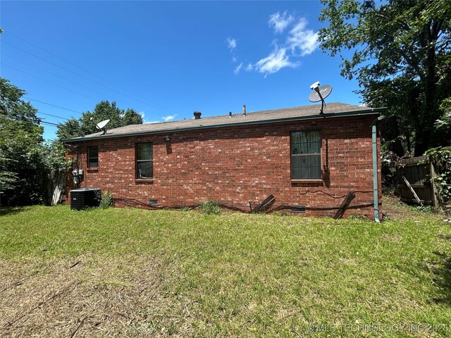 1621 Center Ln, Muskogee, OK 74403 - view of side of property with cooling unit, brick siding, and crawl space