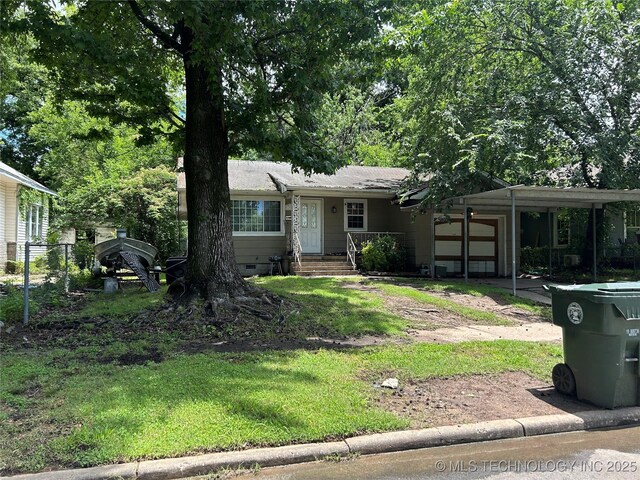 1224 N F St, Muskogee, OK 74403 - view of front of property with a garage, driveway, and crawl space