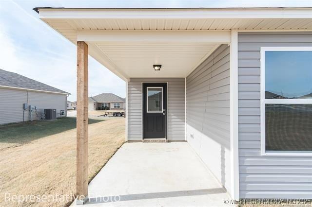 8508 E Queens St, Broken Arrow, OK 74014 - entrance to property with central AC unit and a lawn