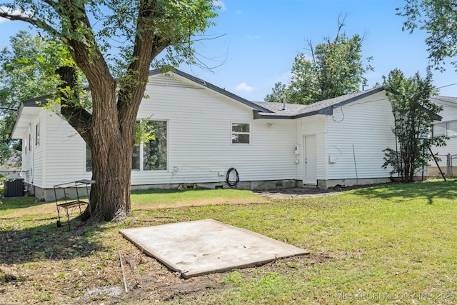 5939 E 26th St, Tulsa, OK 74114 - back of property featuring cooling unit, a lawn, crawl space, and a patio