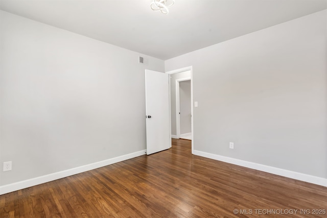 5939 E 26th St, Tulsa, OK 74114 - unfurnished room featuring baseboards and wood finished floors