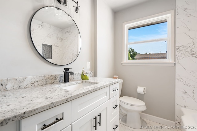 5939 E 26th St, Tulsa, OK 74114 - bathroom with marble finish flooring, vanity, toilet, and baseboards