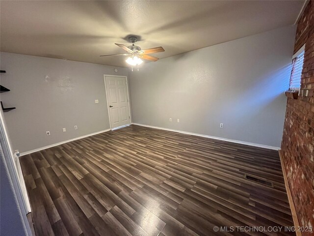 114227 S 4172nd Rd, Checotah, OK 74426 - spare room with a ceiling fan and dark wood finished floors