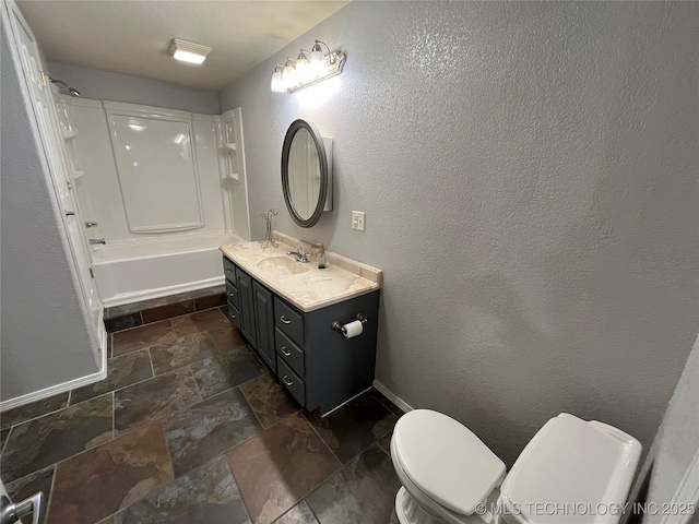 114227 S 4172nd Rd, Checotah, OK 74426 - full bathroom featuring stone tile flooring, toilet, vanity, shower / tub combination, and baseboards
