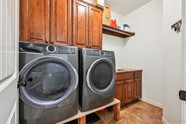 16425 E 49th St, Tulsa, OK 74134 - laundry area featuring independent washer and dryer, cabinet space, and baseboards