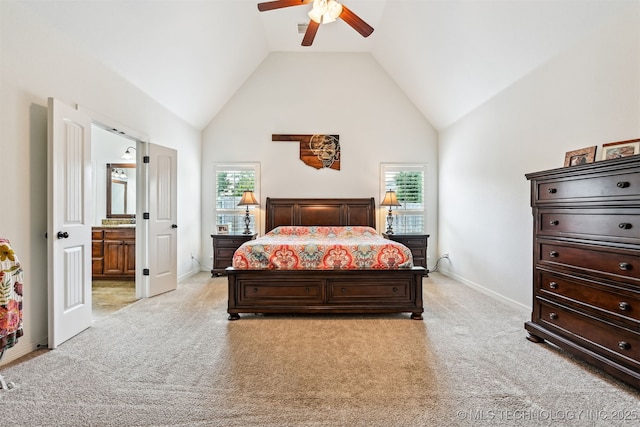 16425 E 49th St, Tulsa, OK 74134 - bedroom featuring light colored carpet, high vaulted ceiling, baseboards, connected bathroom, and ceiling fan