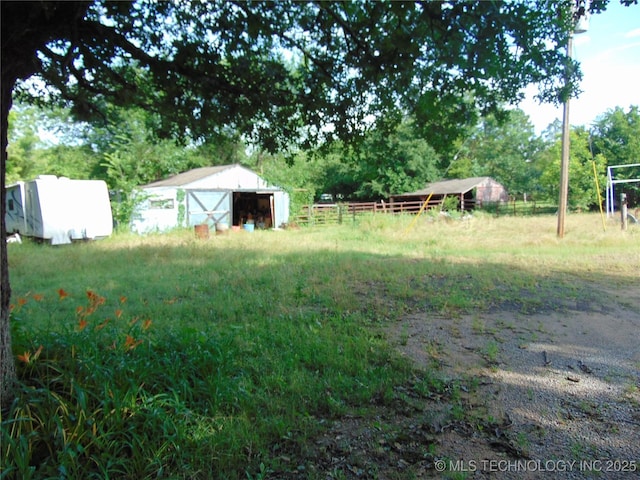 6721 Swayback, Sulphur, OK 73086 - view of yard with an outbuilding and a pole building