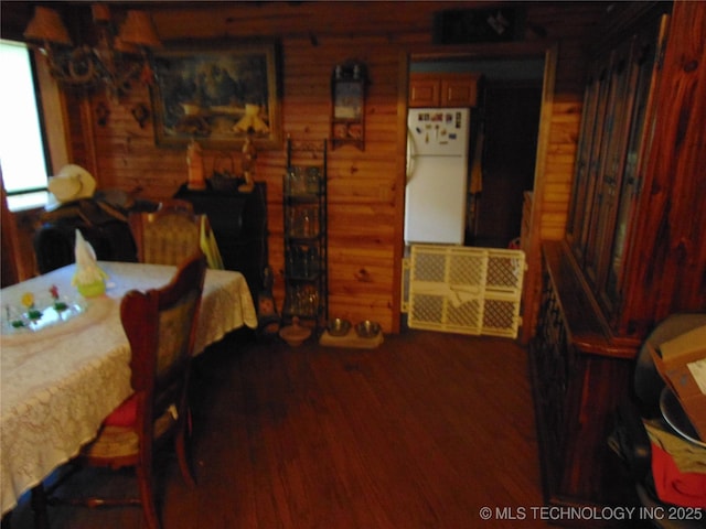 6721 Swayback, Sulphur, OK 73086 - bedroom with freestanding refrigerator and wood finished floors