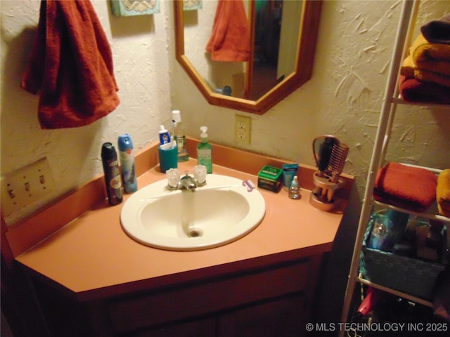 6721 Swayback, Sulphur, OK 73086 - bathroom featuring vanity and a textured wall
