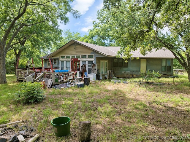 6721 Swayback, Sulphur, OK 73086 - rear view of property with a wooden deck