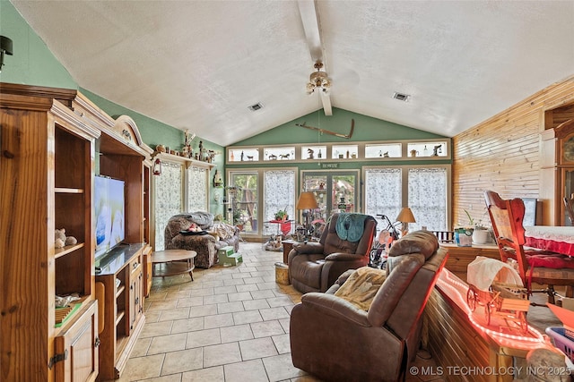 6721 Swayback, Sulphur, OK 73086 - tiled living area featuring a textured ceiling, a ceiling fan, and wood walls