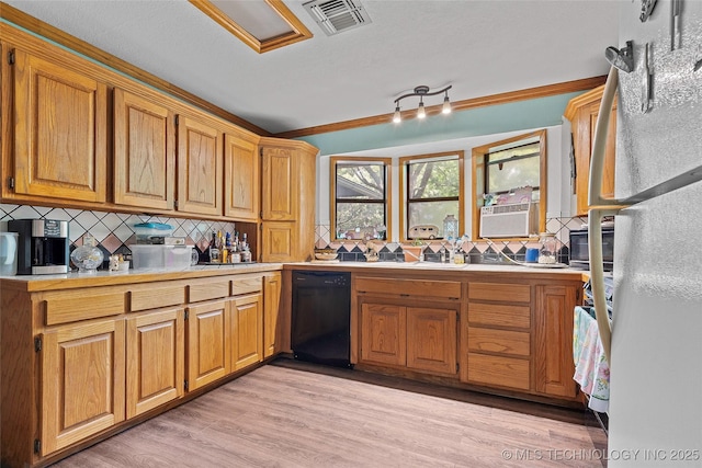 6721 Swayback, Sulphur, OK 73086 - kitchen with black dishwasher, backsplash, freestanding refrigerator, cooling unit, and light countertops