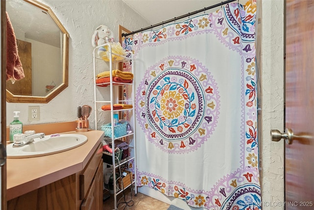 6721 Swayback, Sulphur, OK 73086 - bathroom featuring a textured wall, vanity, and a shower with curtain
