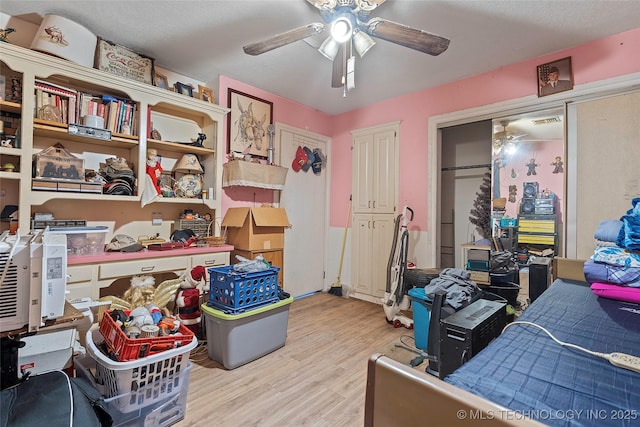 6721 Swayback, Sulphur, OK 73086 - bedroom with light wood finished floors and ceiling fan