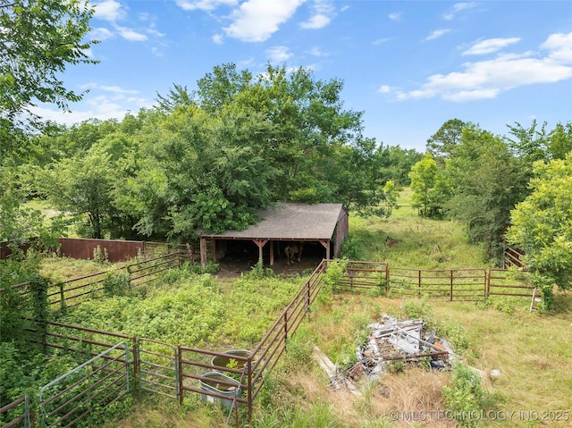 6721 Swayback, Sulphur, OK 73086 - view of yard featuring a wooded view and an outdoor structure