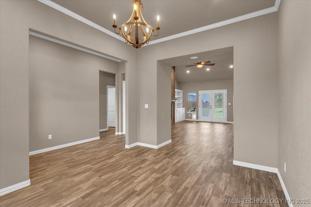 97 Paytons Pl, Durant, OK 74701 - empty room featuring a chandelier, wood finished floors, crown molding, and baseboards