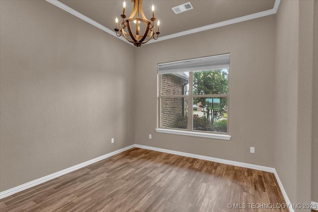 97 Paytons Pl, Durant, OK 74701 - unfurnished room featuring a chandelier, baseboards, wood finished floors, and ornamental molding