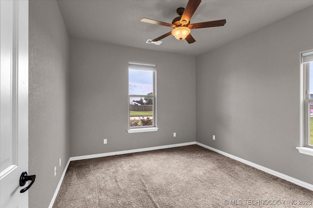 97 Paytons Pl, Durant, OK 74701 - empty room featuring carpet flooring, healthy amount of natural light, and a ceiling fan