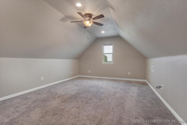 97 Paytons Pl, Durant, OK 74701 - additional living space featuring carpet floors, vaulted ceiling, ceiling fan, baseboards, and a textured ceiling