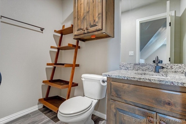 97 Paytons Pl, Durant, OK 74701 - bathroom with toilet, vanity, wood finished floors, and baseboards