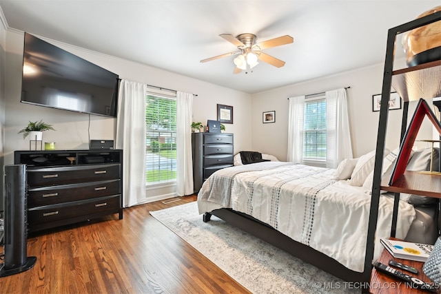 3510 E 21st Pl, Tulsa, OK 74114 - bedroom with wood finished floors and ceiling fan