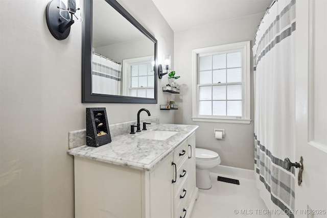 3510 E 21st Pl, Tulsa, OK 74114 - bathroom with vanity, toilet, and baseboards